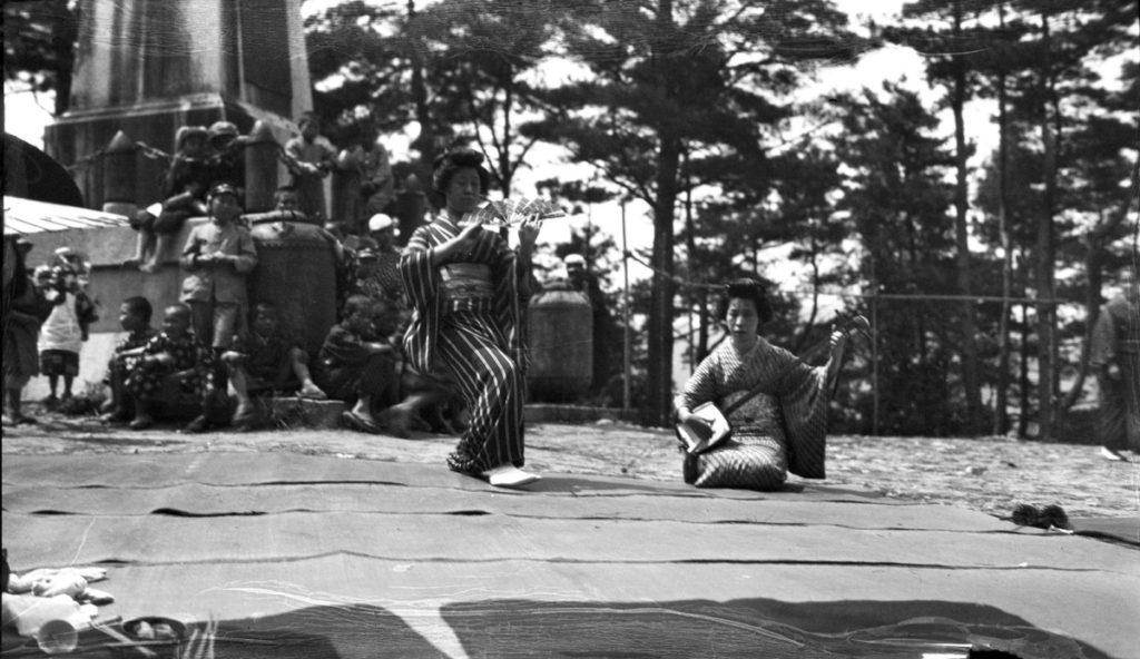 Girls performing ancient fencing called naginata. They wear school-girl costume. Two days entertainment in home of Mr. G. Tsukamoto. © The Field Museum, CSA50302